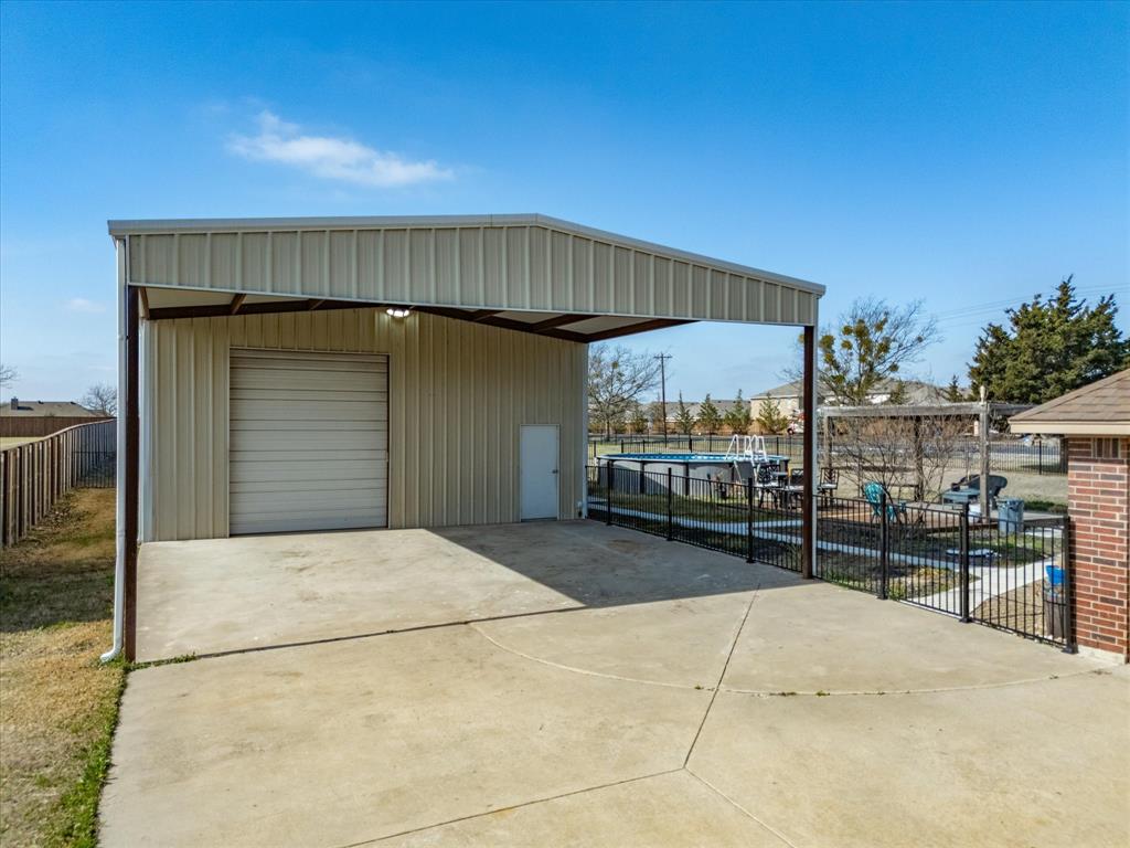 10000 Fireside Lane Forney, TX 75126 - Photo 10 of 40 View of outbuilding featuring concrete driveway