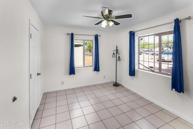 a view of kitchen and kitchen with stainless steel appliances wooden floor
