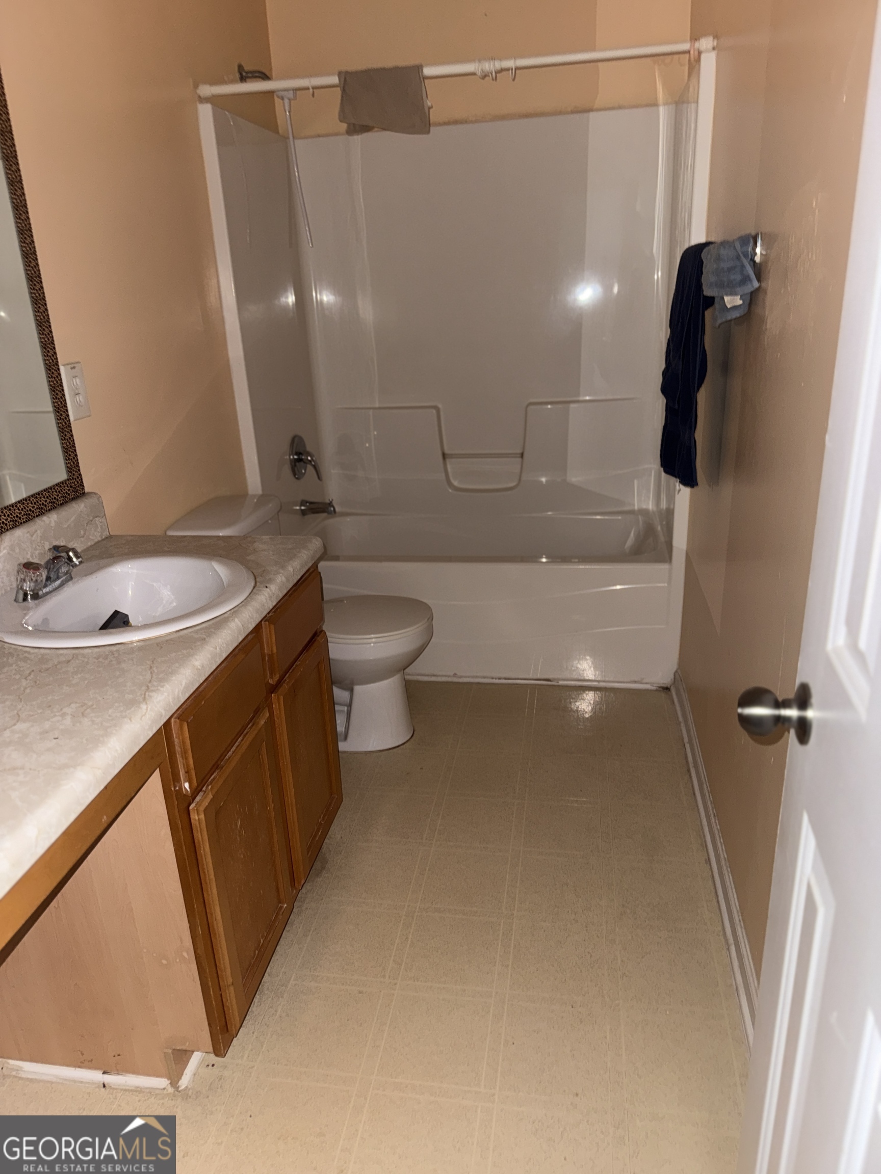 11631 Kades Trail Hampton, GA 30228 - Photo 5 of 5 a bathroom with a sink a toilet and shower