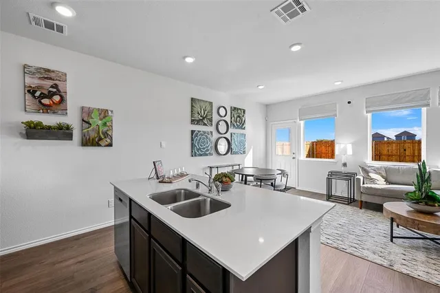 a view of a house with brick walls and a yard