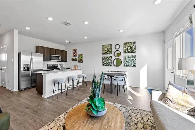 a stove top oven sitting inside of a kitchen
