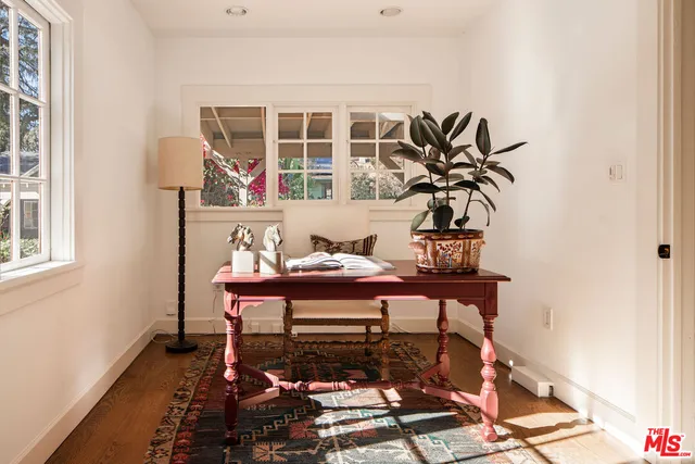 a workspace with furniture and a potted plant