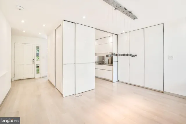 a view of room with window and furniture