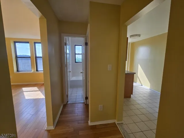 a view of a kitchen with granite countertop cabinets