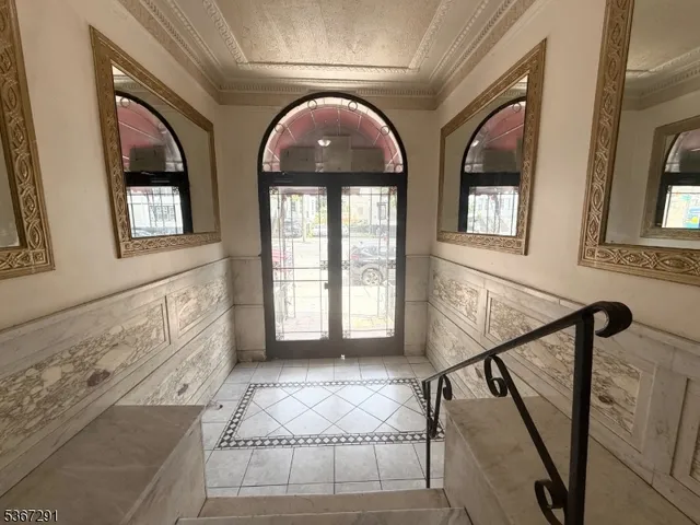 a view of hall way with furniture