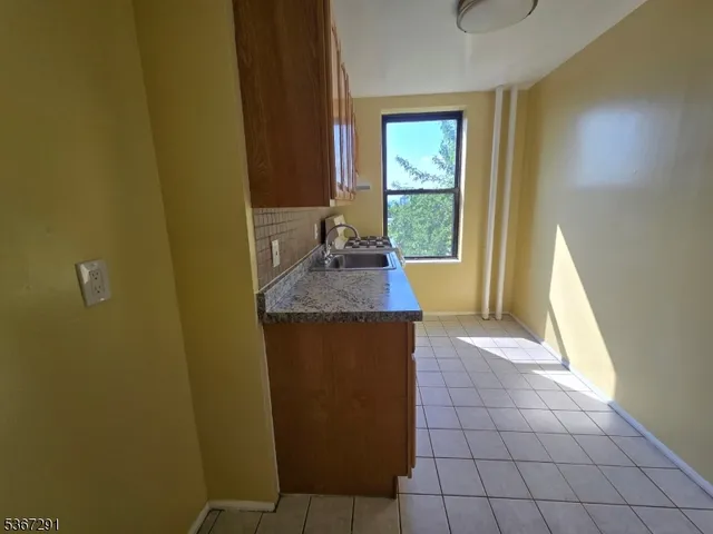 a view of hallway with wooden floor