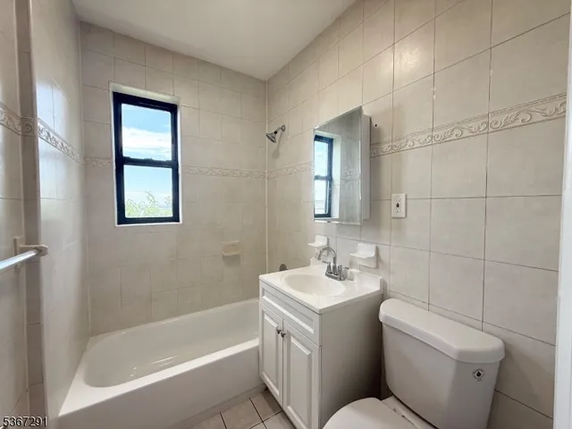 a bathroom with a toilet sink and bathtub