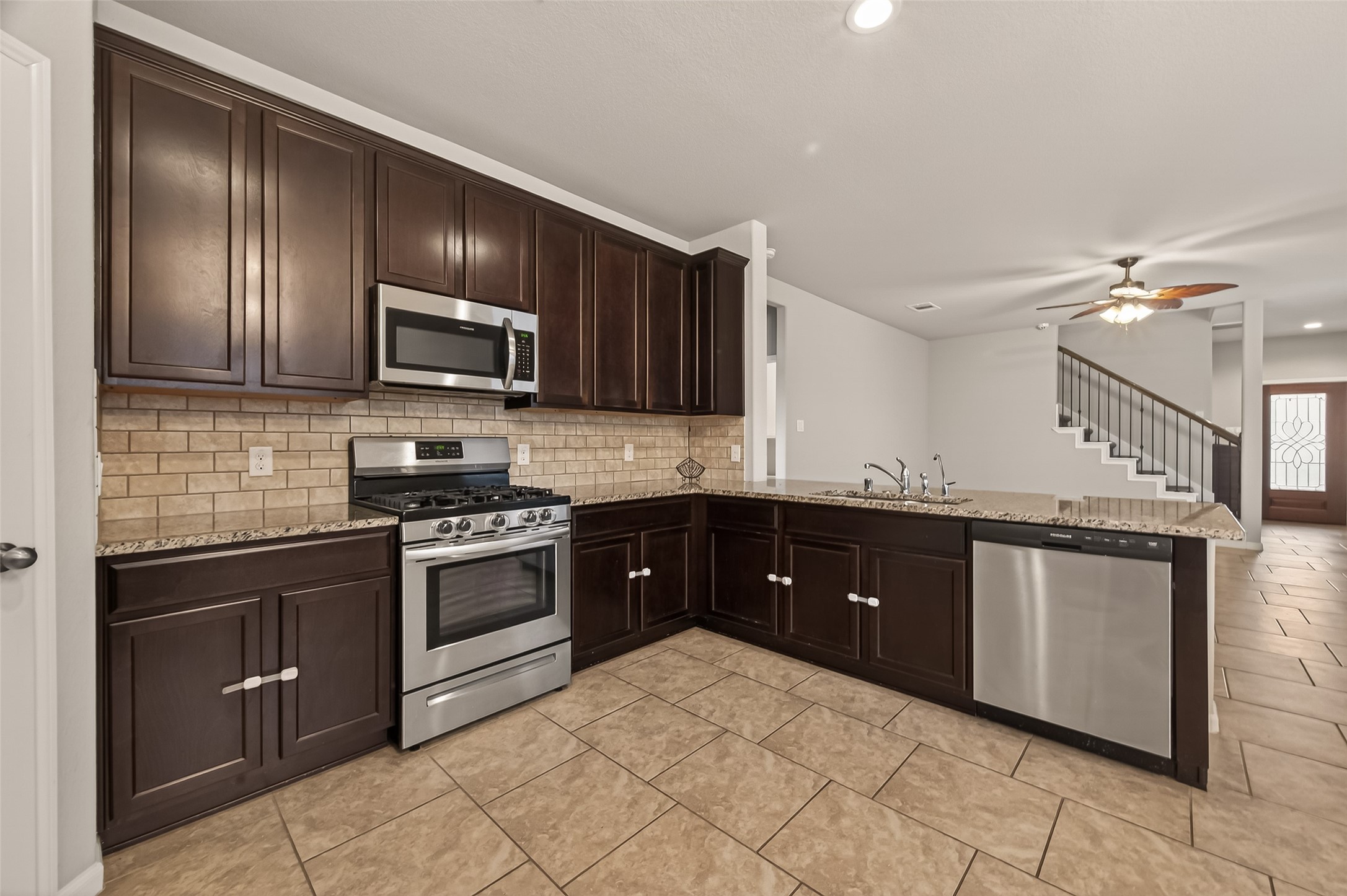 2510 Meerstad Lane Houston, TX 77047 - Photo 16 of 49 a kitchen with granite countertop stainless steel appliances and sink