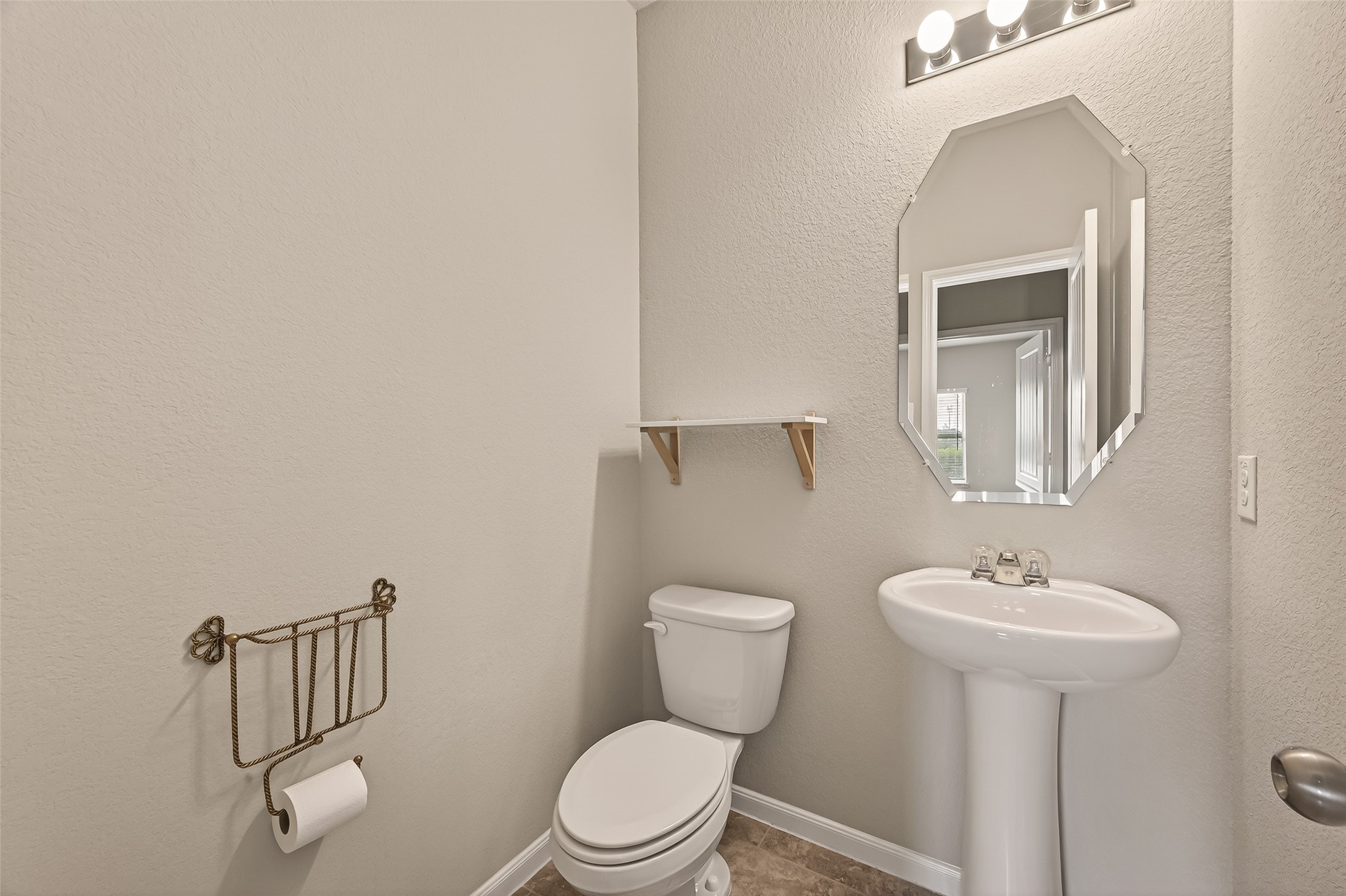 2510 Meerstad Lane Houston, TX 77047 - Photo 21 of 49 a bathroom with a toilet a sink and mirror