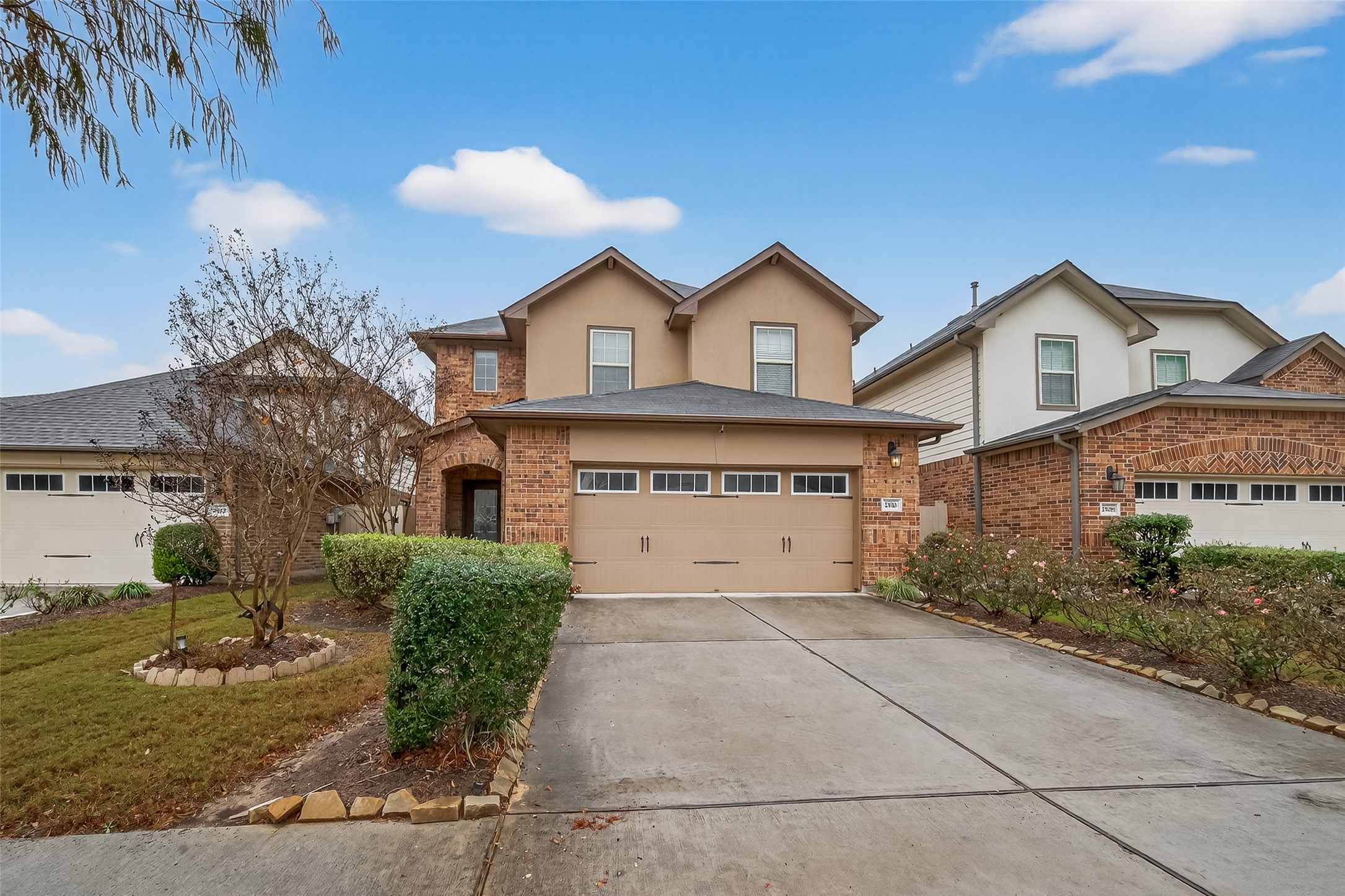 2510 Meerstad Lane Houston, TX 77047 - Photo 4 of 49 a front view of a house with a yard and garage