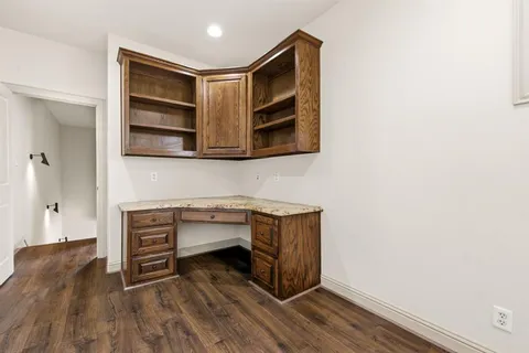 a kitchen with stainless steel appliances a stove and cabinets