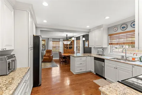a bathroom with a sink a mirror and a window