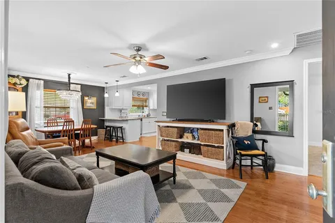 a livingroom with a couch and a bookshelf