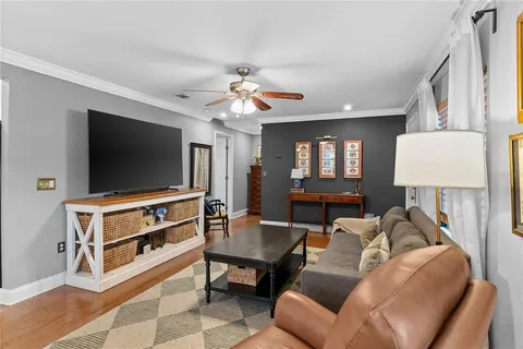 a kitchen with refrigerator cabinets and windows