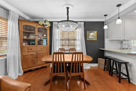 a kitchen with stainless steel appliances granite countertop a stove and cabinets