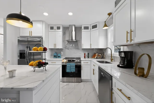a kitchen with a sink a stove and window