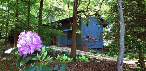 a view of a house with potted plants
