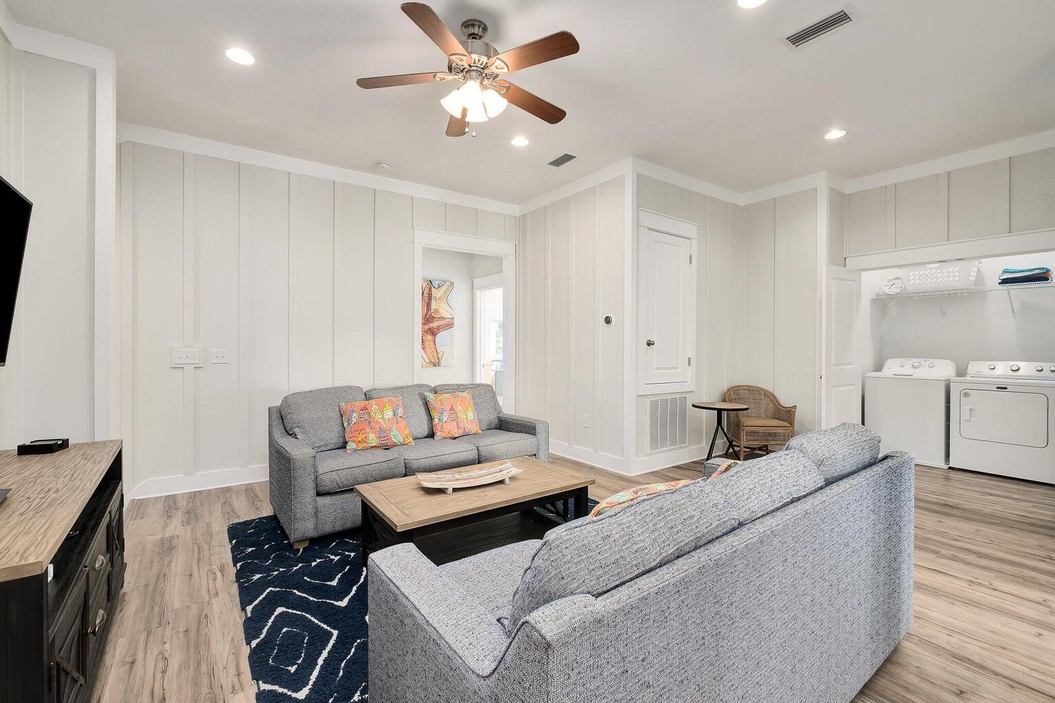 99 Stingray Street Destin, FL 32541 - Photo 16 of 28 a living room with furniture and a flat screen tv