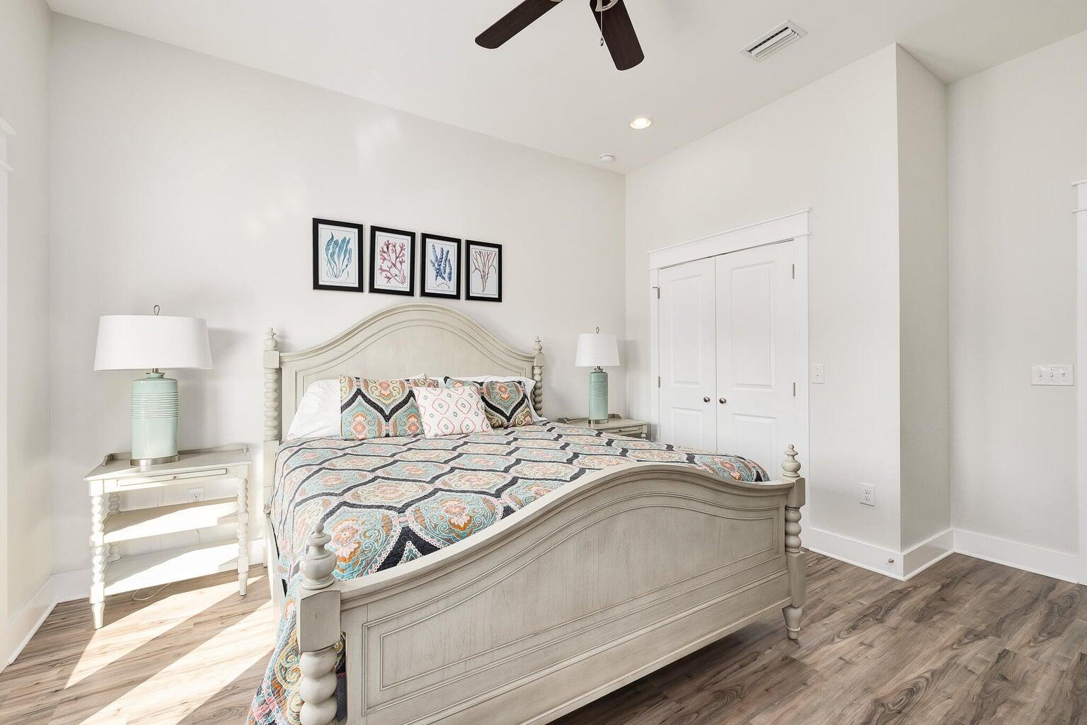 99 Stingray Street Destin, FL 32541 - Photo 17 of 28 a bedroom with a bed and a ceiling fan