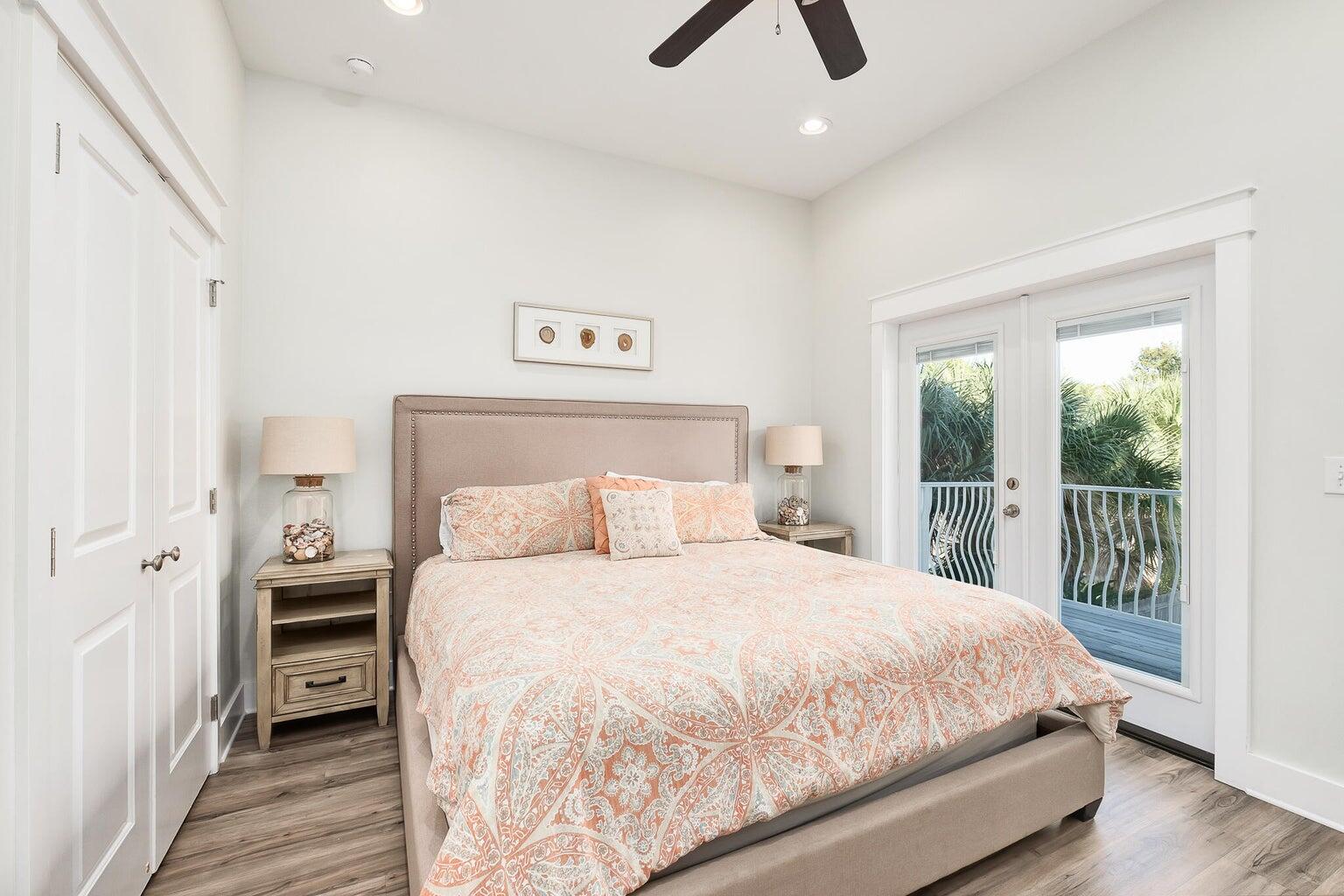 99 Stingray Street Destin, FL 32541 - Photo 23 of 28 a bedroom with a large bed and a large window