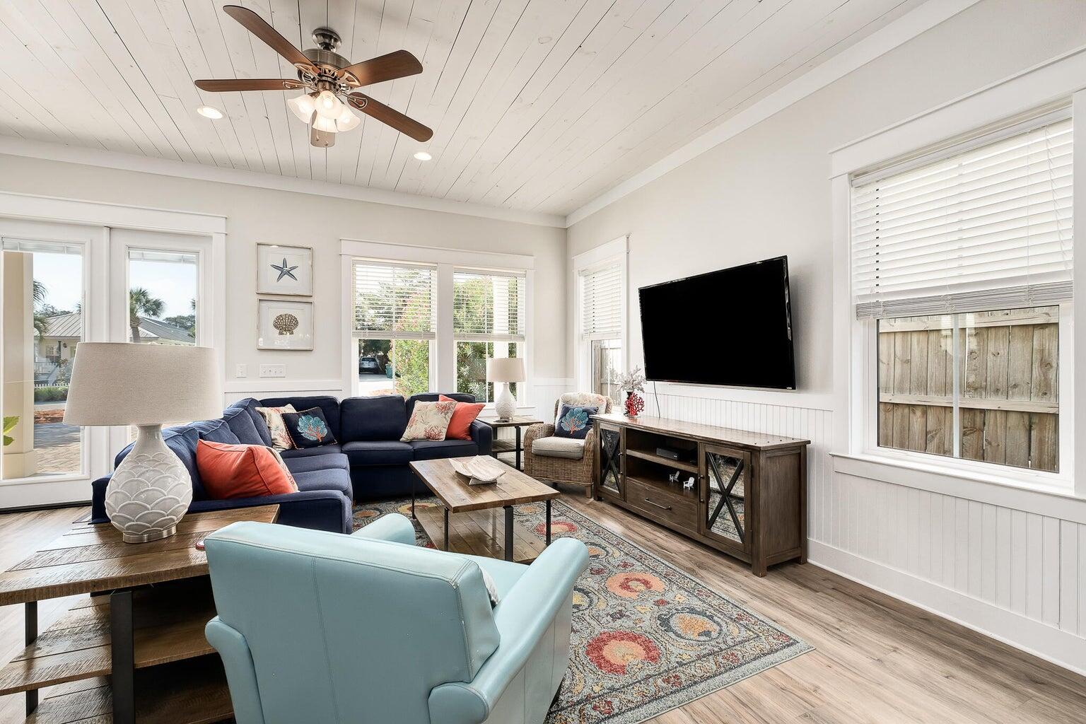 99 Stingray Street Destin, FL 32541 - Photo 7 of 28 a living room with furniture and a flat screen tv