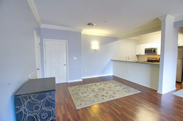a view of kitchen and wooden floor