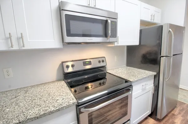 a kitchen with a stove and a microwave