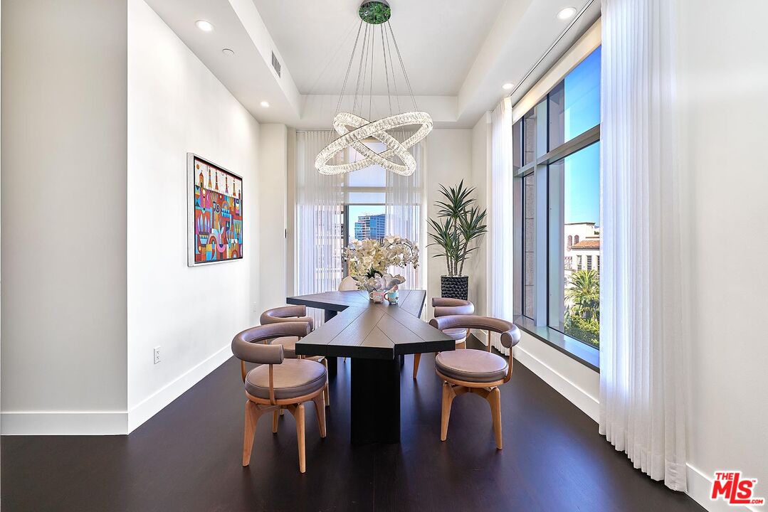 10776 Wilshire Boulevard, Unit 603 Los Angeles, CA 90024 - Photo 15 of 37 a view of a dining room with furniture window and wooden floor