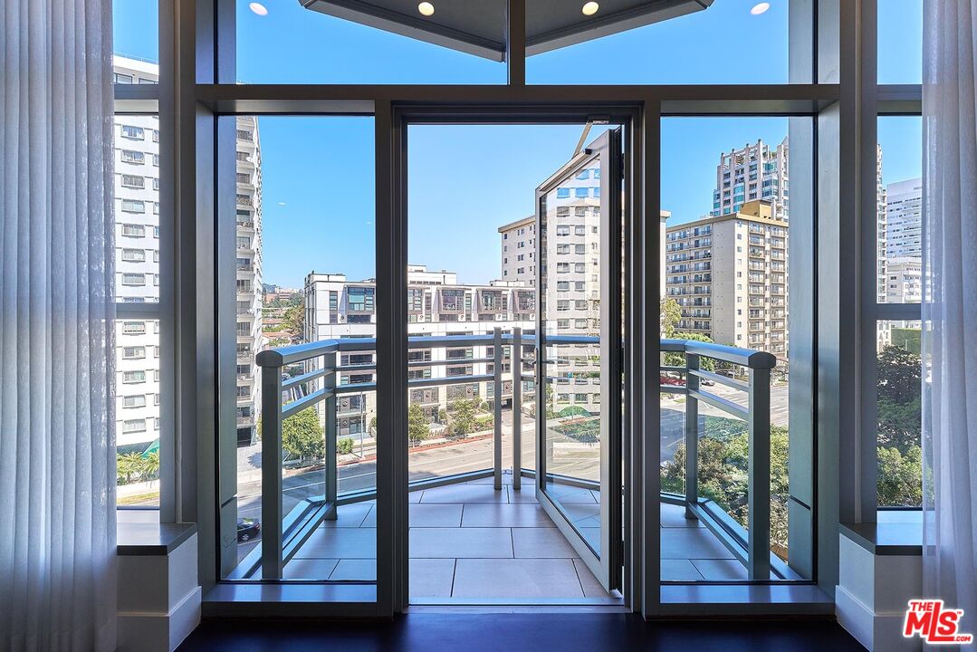 10776 Wilshire Boulevard, Unit 603 Los Angeles, CA 90024 - Photo 37 of 37 a view of a living room and balcony