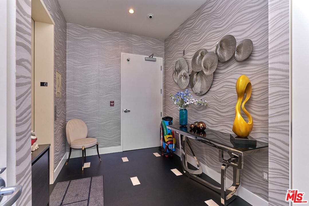 10776 Wilshire Boulevard, Unit 603 Los Angeles, CA 90024 - Photo 8 of 37 a view of a room with gym equipment