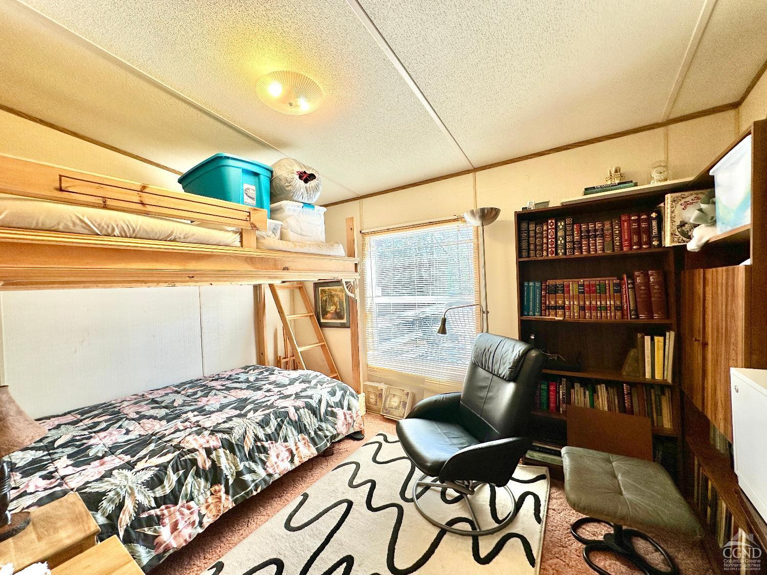 85 Laurel House Road Hunter, NY 12436 - Photo 9 of 20 a bedroom with a bed and a table in it