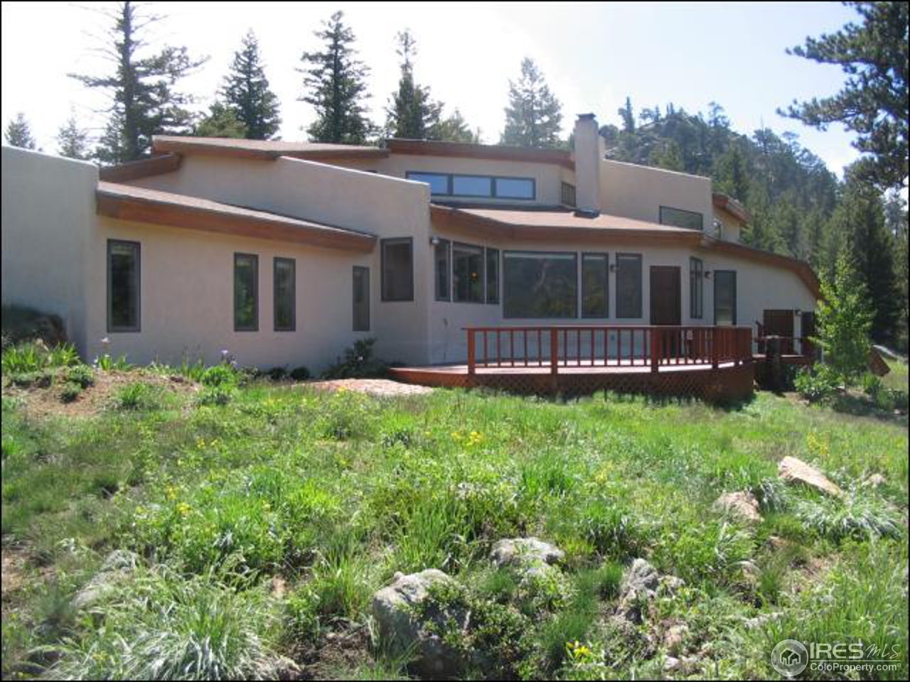 63 Good Friday Road Boulder, CO 80302 - Photo 1 of 12 a view of a house with a big yard plants and large trees