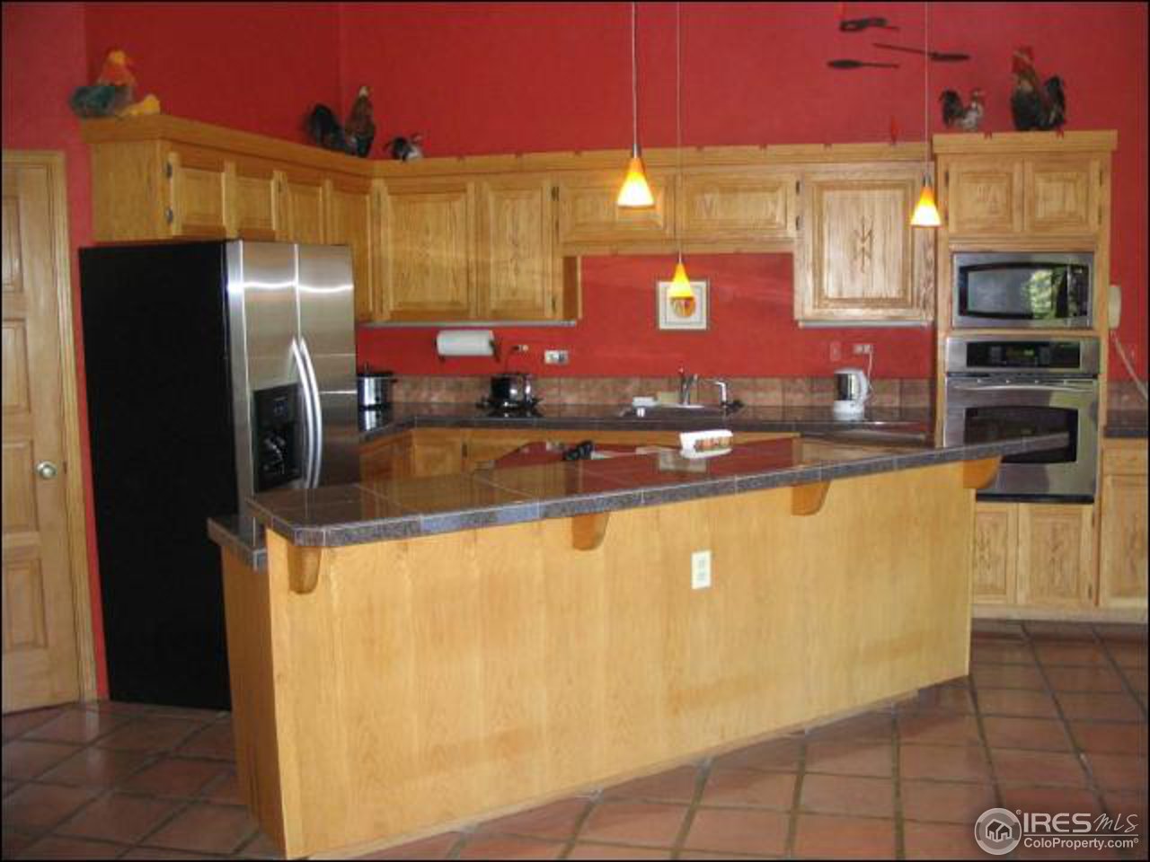 63 Good Friday Road Boulder, CO 80302 - Photo 4 of 12 a kitchen with stainless steel appliances granite countertop a refrigerator and a stove