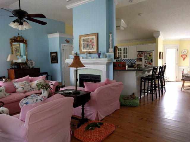 265 Beck Road Williston, SC 29853 - Photo 4 of 12 a living room with furniture a fireplace and a chandelier
