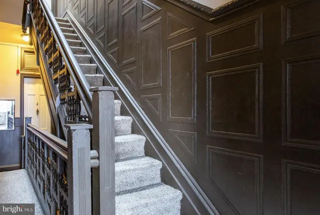 a view of a brick house with a yard