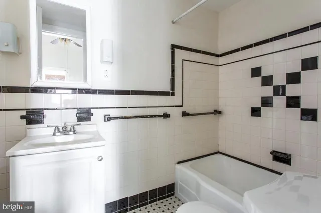 a work room with furniture and wooden floor