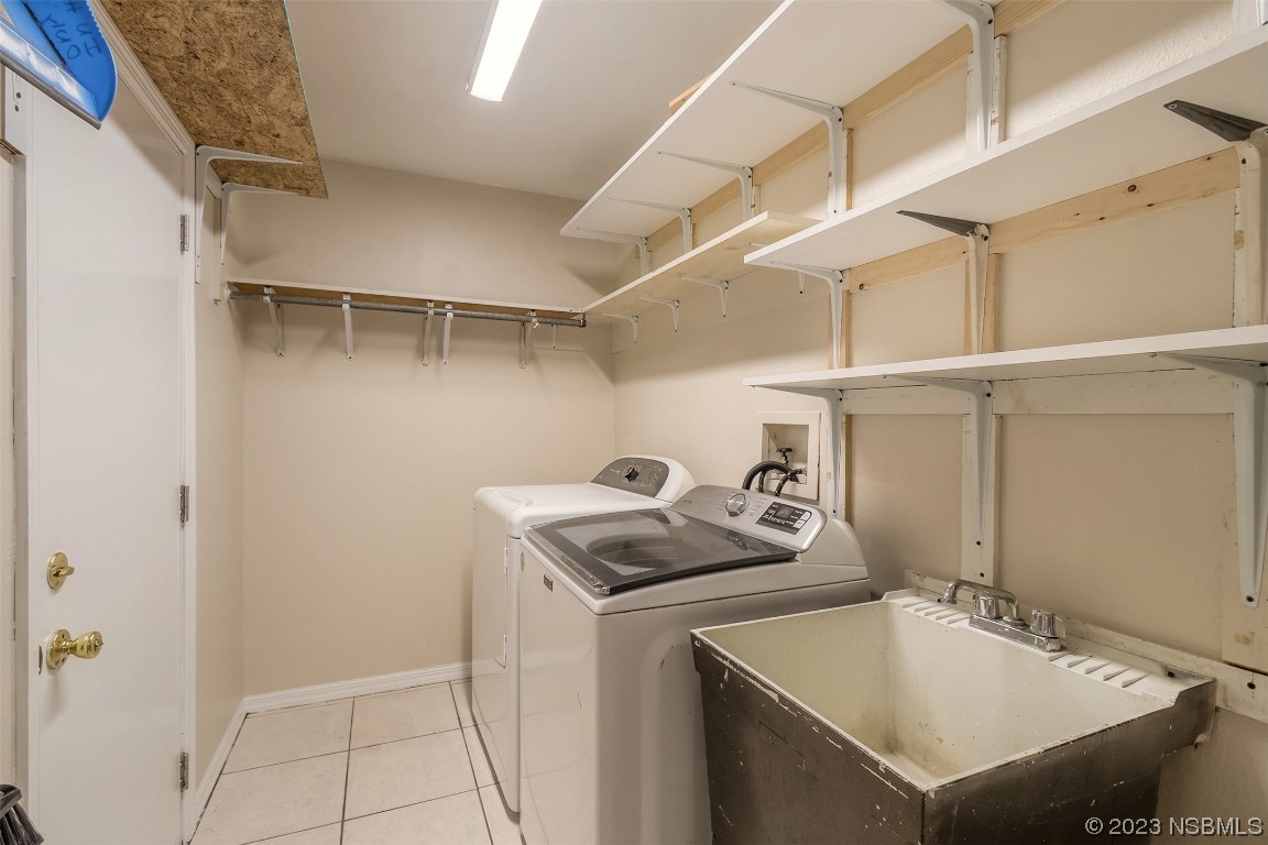 2311 Pine Tree Drive Edgewater, FL 32141 - Photo 20 of 32 a utility room with cabinets