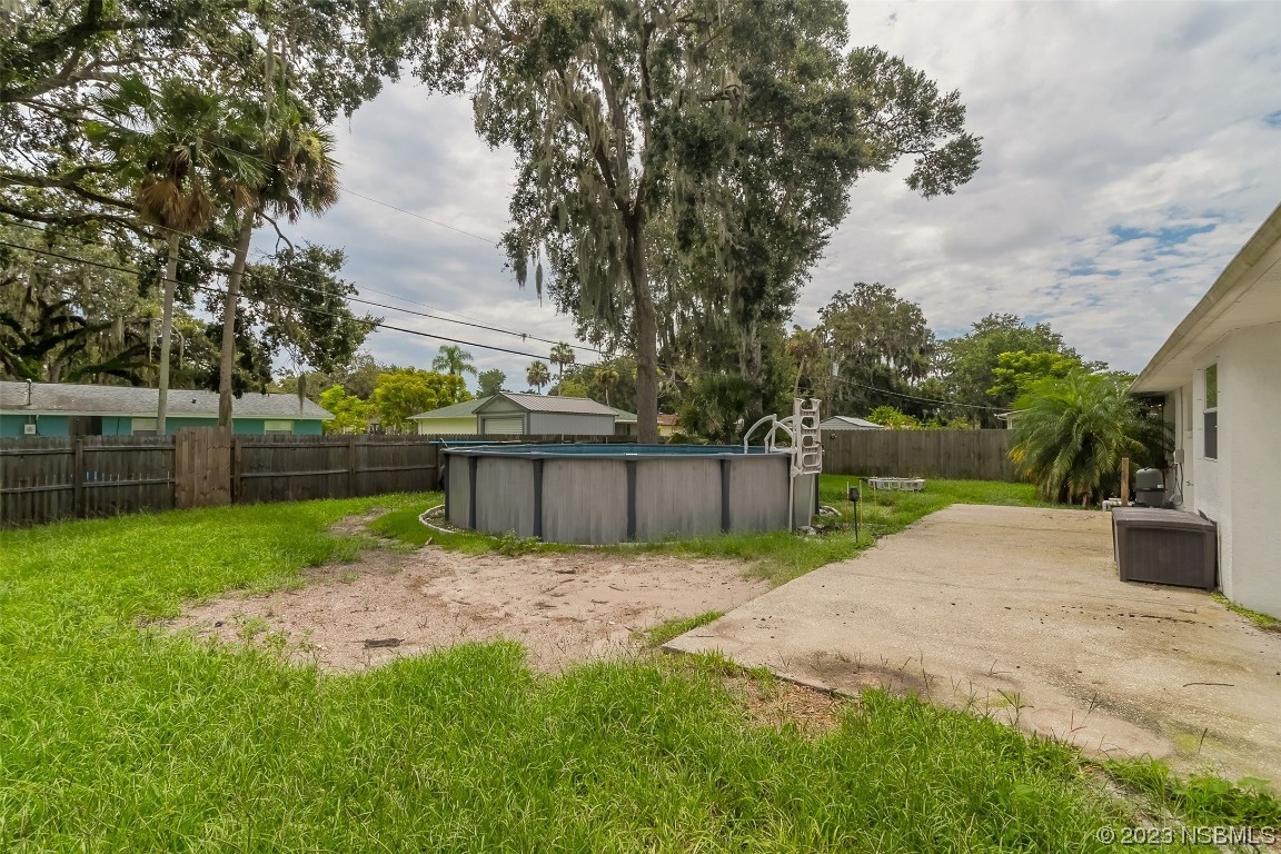 2311 Pine Tree Drive Edgewater, FL 32141 - Photo 21 of 32 a view of backyard with green space