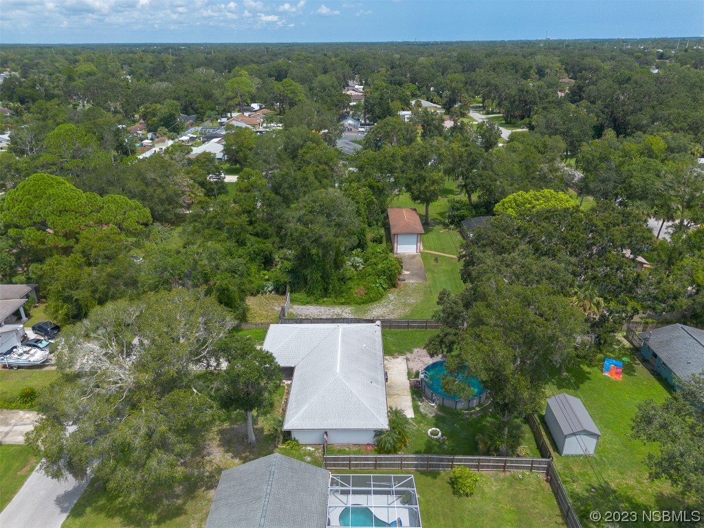 2311 Pine Tree Drive Edgewater, FL 32141 - Photo 27 of 32 an aerial view of residential houses with outdoor space and trees