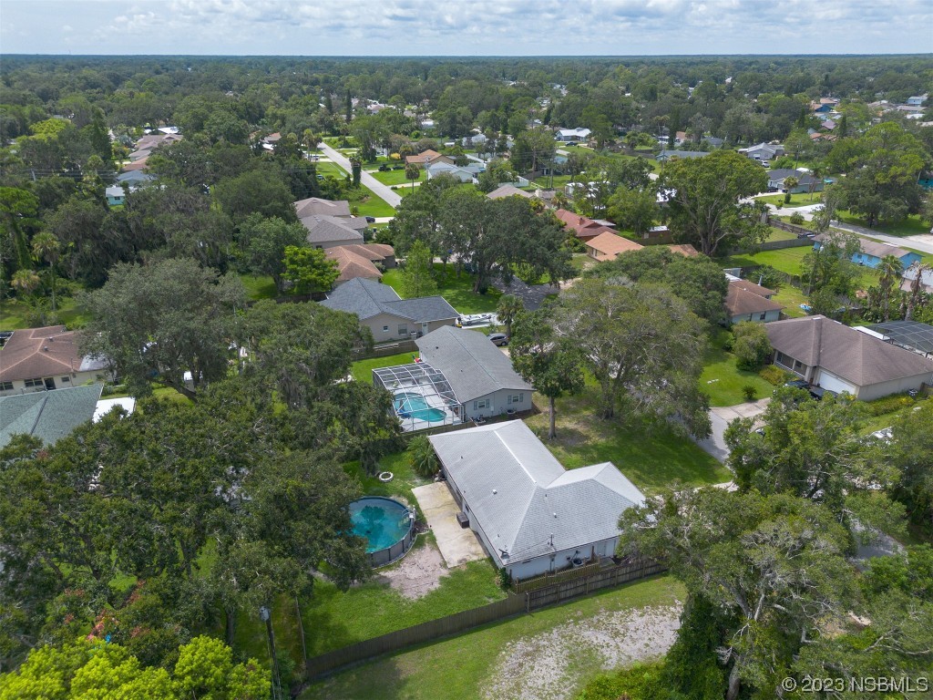 2311 Pine Tree Drive Edgewater, FL 32141 - Photo 30 of 32 an aerial view of residential houses with outdoor space and trees
