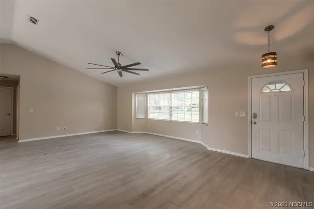 a view of an empty room with a window