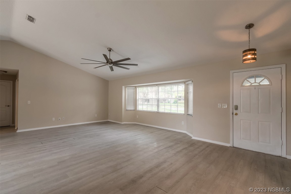2311 Pine Tree Drive Edgewater, FL 32141 - Photo 5 of 32 a view of an empty room with a window