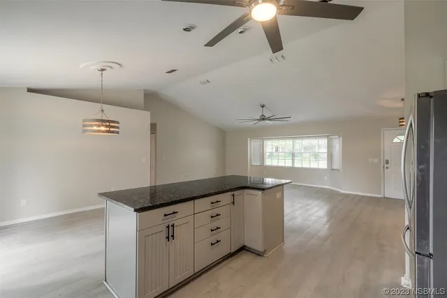 a view of a windows and chandelier in a room