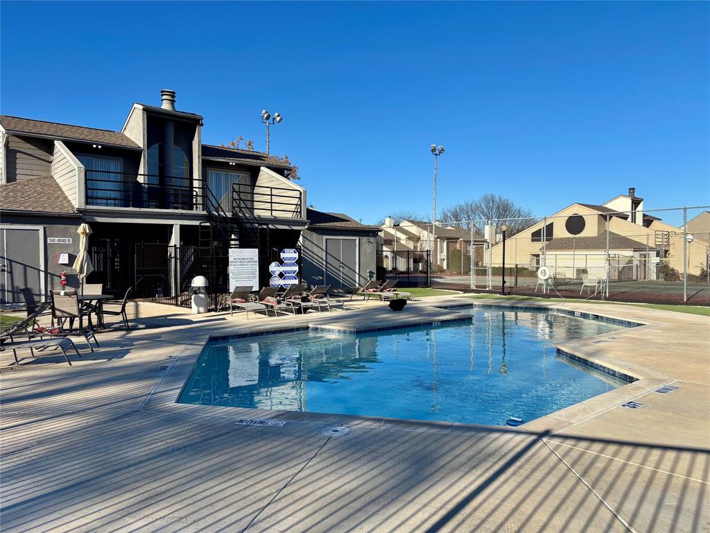 a view of a swimming pool with seating area