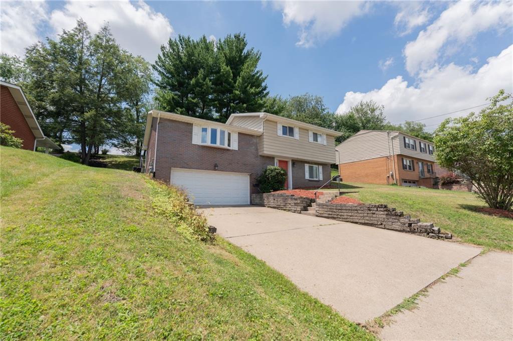 200 Foxcroft Road Pittsburgh, PA 15220 - Photo 3 of 43 a front view of a house with a yard and trees