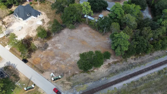 a view of a yard with potted plants
