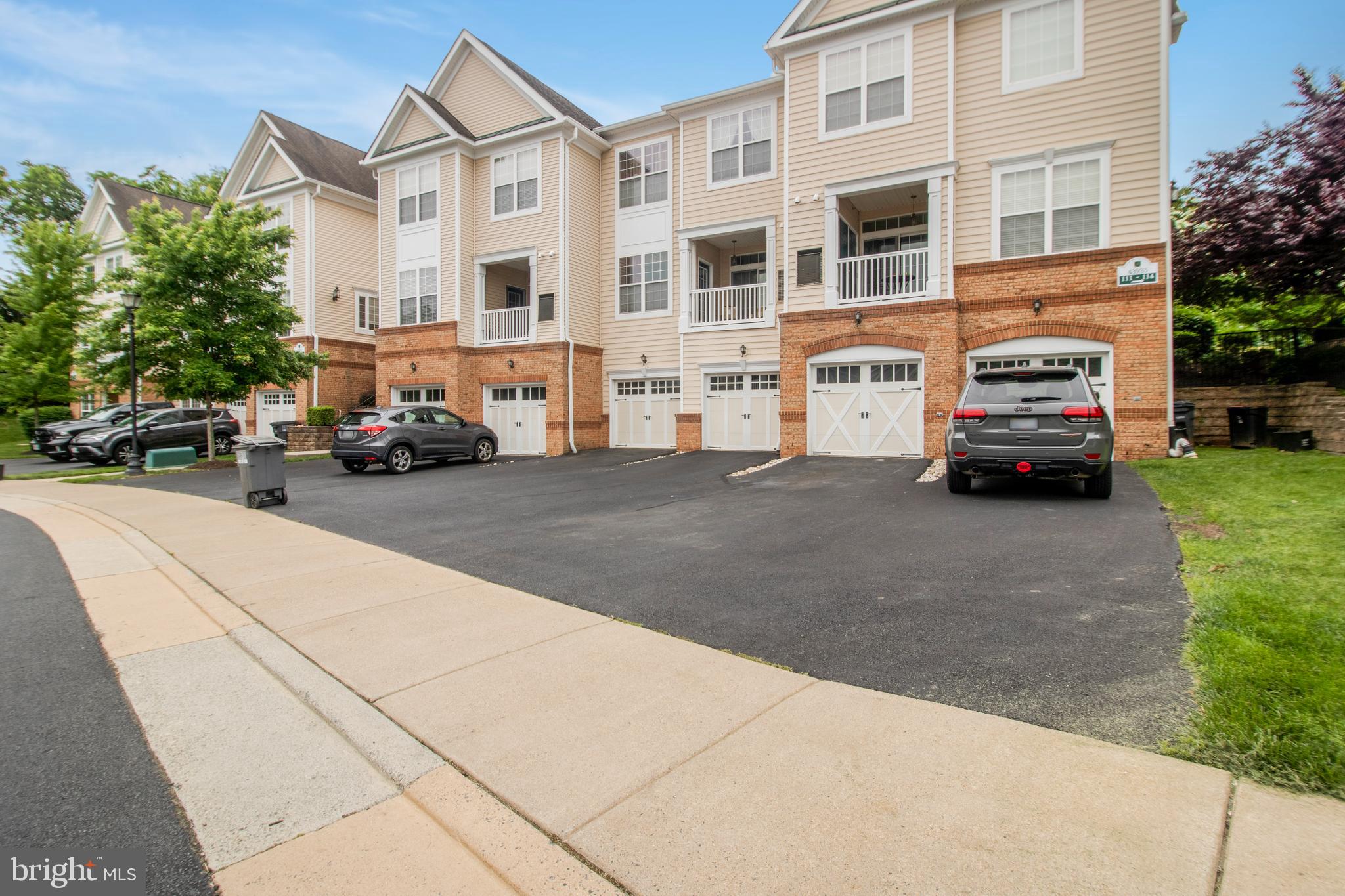 43935 Hickory Corner Terrace, Unit 113 Ashburn, VA 20147 - Photo 1 of 43 a car parked in front of a building