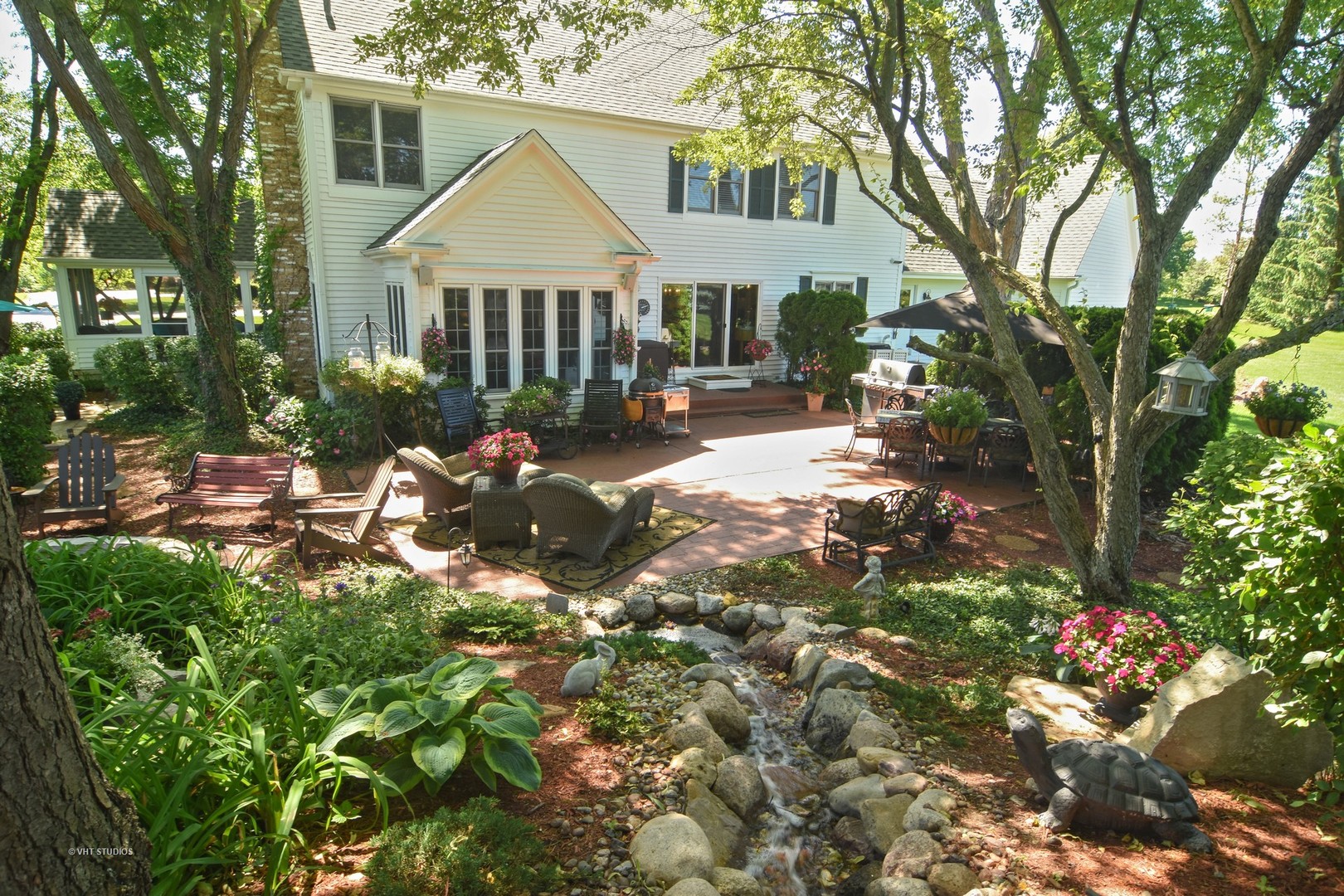 20755 North Weatherstone Road Kildeer, IL 60047 - Photo 39 of 61 a backyard of a house with table and chairs