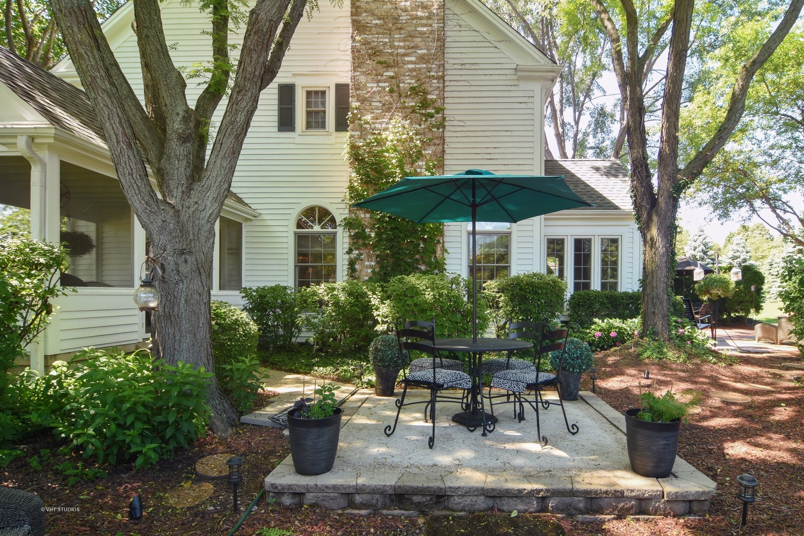 20755 North Weatherstone Road Kildeer, IL 60047 - Photo 40 of 61 a view of a patio with table and chairs under an umbrella