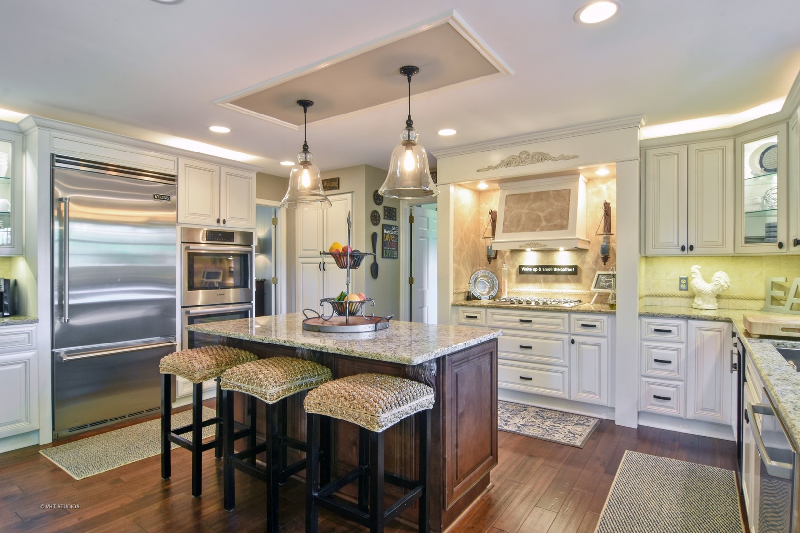 20755 North Weatherstone Road Kildeer, IL 60047 - Photo 5 of 61 a kitchen with stainless steel appliances kitchen island granite countertop a table chairs sink refrigerator and cabinets